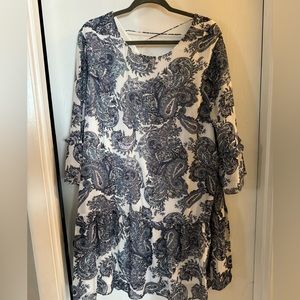 Paisley print dress with cut out upper back.